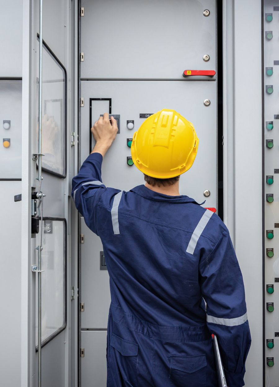 An electrical engineer working in a box.